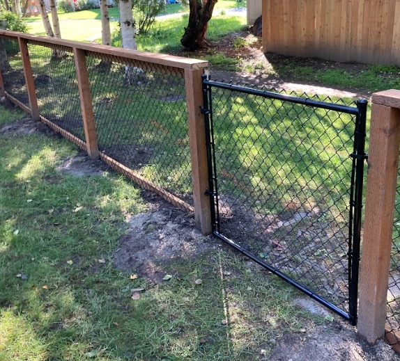 California-style chain link fence with cedar posts and top rail