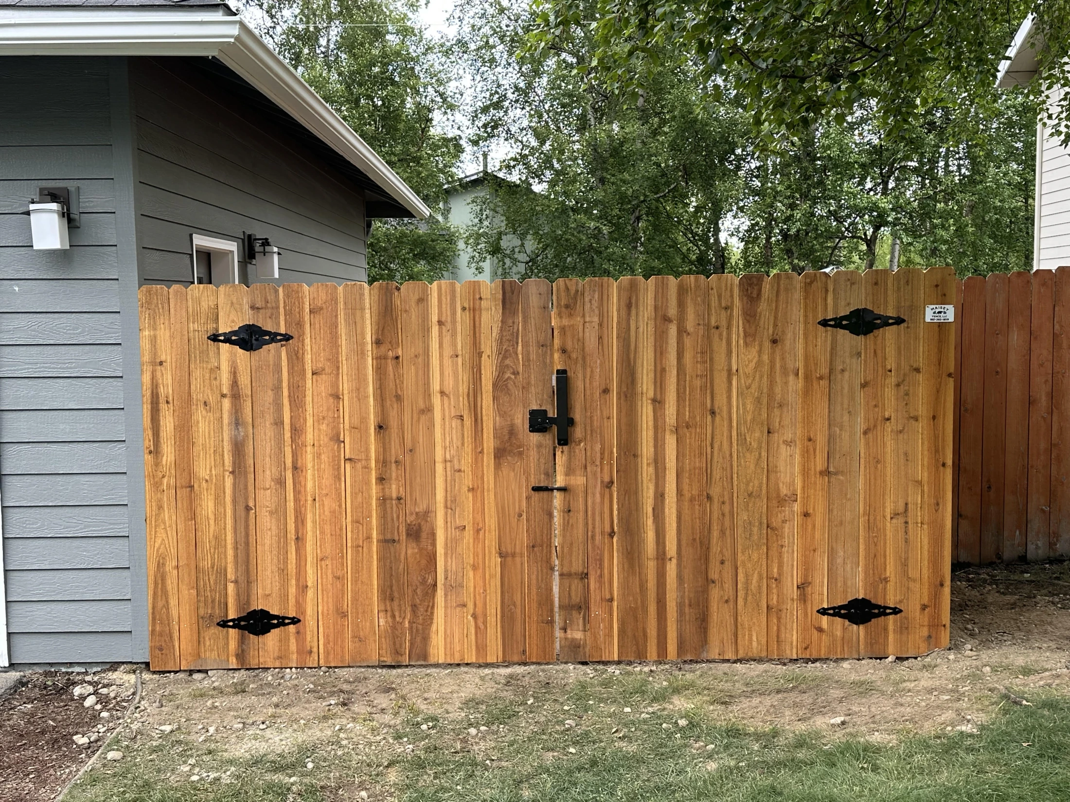 Cedar privacy walk gate with decorative black diamond hinges installed by Maisey Fence