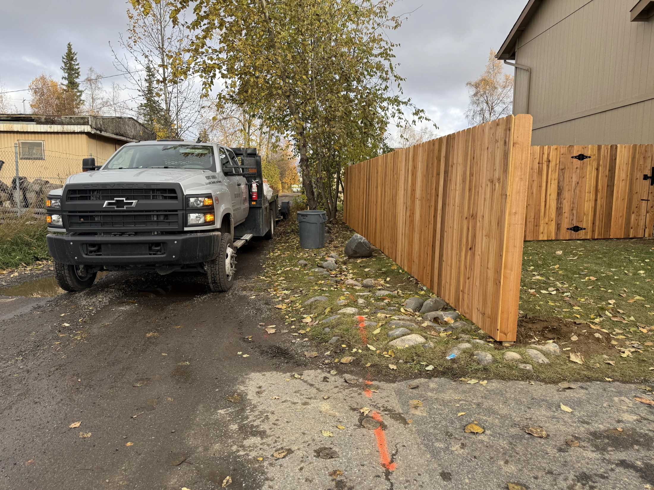 Prestained cedar privacy fence installation by Maisey Fence in Anchorage, Alaska
