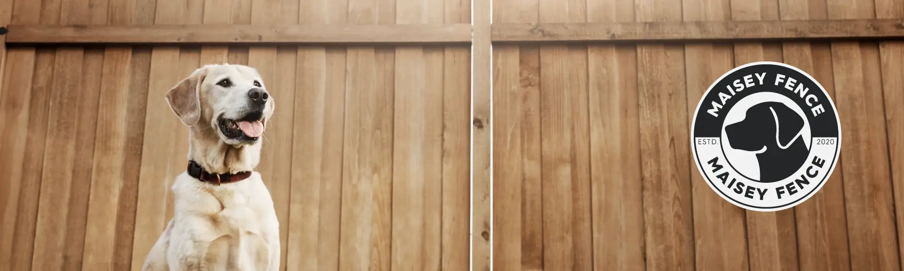 Happy dog safely contained behind quality Maisey Fence installation in Anchorage, Alaska